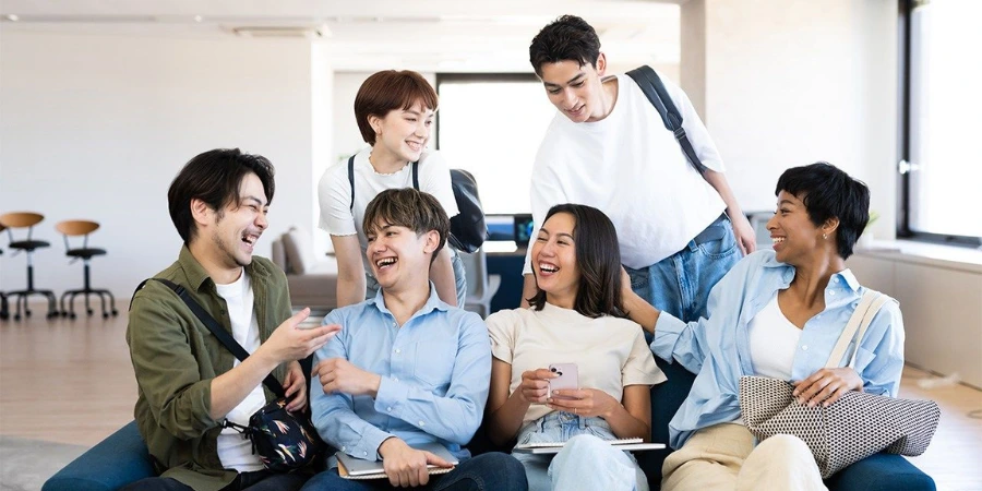 Foreign students in Japan cheerfully talking among each other.