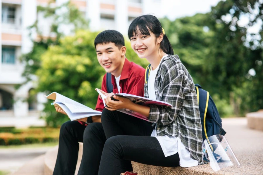 Japanese students smiling at the camera