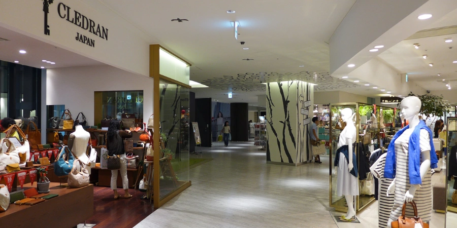 Bright interior of Grand Front Osaka South Building 3rd floor in 2014, showcasing fashion boutiques, escalators, and contemporary shopping mall architecture.