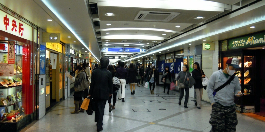 Vibrant underground Whity Umeda mall interior with retail stores, lighting fixtures, and shopper activity beneath Osaka's Umeda station complex.