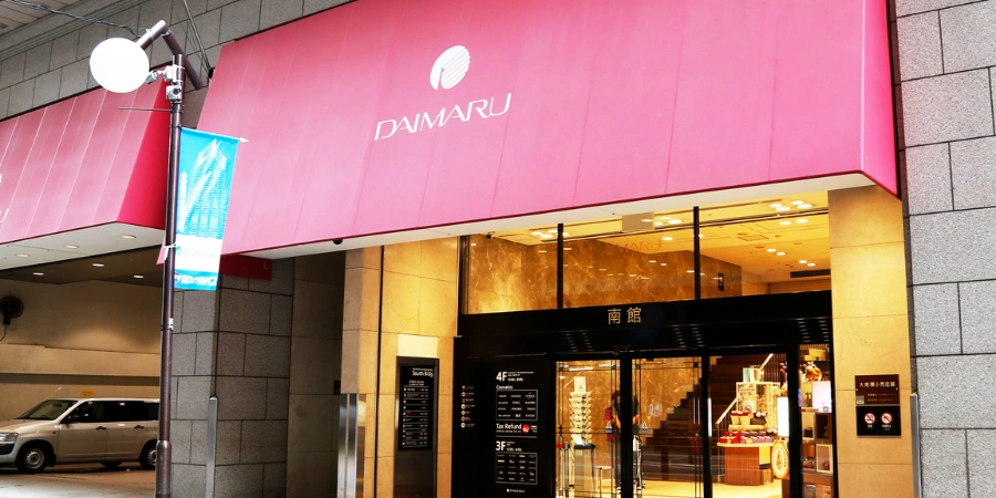 Entrance of Daimaru Shinsaibashi department store in Osaka shopping district at night