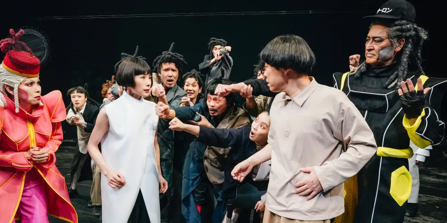 Ensemble of actors performing an intense scene during the 320°F Play theatre production, featuring expressive performances, dramatic costumes, and a dynamic contemporary stage performance
