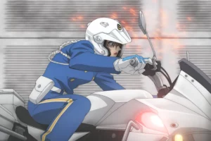Anime still from Detective Conan M29 showing a police officer in a blue uniform riding a white motorcycle through a high-speed chase scene.