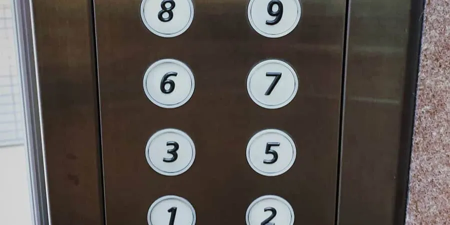 Lift button panel in a Japanese building, where the fourth floor is often left out