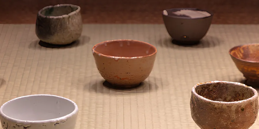 Collection of handcrafted Japanese ceramic tea bowls displayed as part of the exhibition.