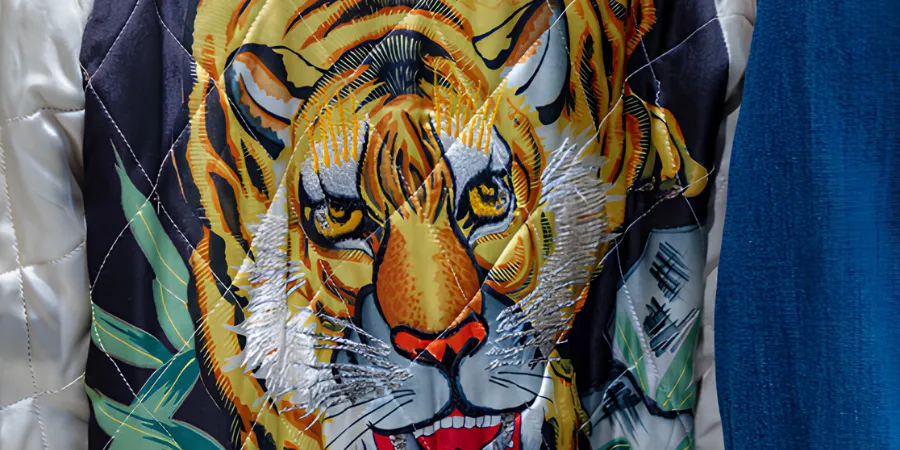 Close-up of an embroidered tiger back design on a traditional Japanese sukajan souvenir jacket.
