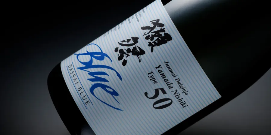 Dassai Blue Junmai Daiginjo Japanese sake bottle, featuring a Type 50 label and traditional Japanese calligraphy