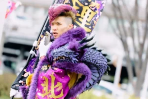 Young person in an elaborate purple dragon costume celebrating Coming-of-Age Day in Kitakyushu, Japan