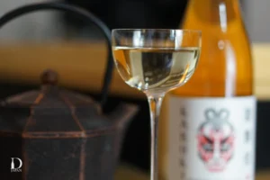 Glass of Japanese sake with a sake bottle in the background at Drink Japan 2026.