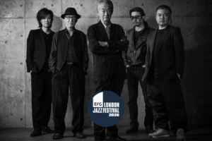 Black and white portrait of the five members of Yoshio Suzuki's band The Blend standing against a concrete wall, overlaid with the EFG London Jazz Festival 2026 roundel, one of seven Japanese bills across the festival in November 2026
