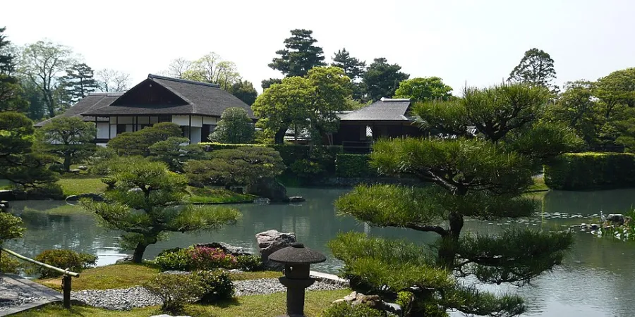 Katsura Imperial Villa garden with traditional Japanese buildings, pine trees and a landscaped pond in Kyoto