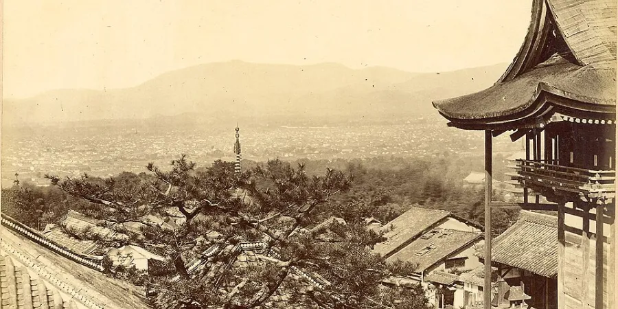 Historic 1870s view of Kyoto from Kiyomizudera showing traditional rooftops, temples and the surrounding mountains