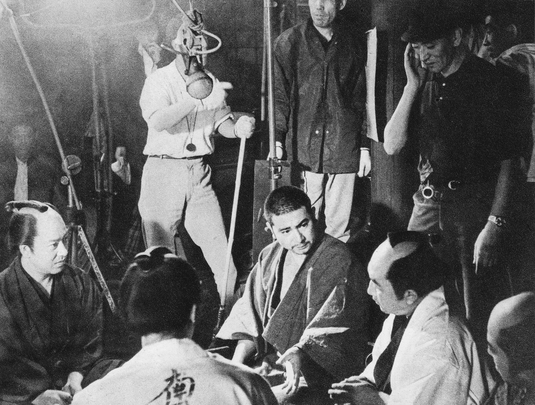 Shintaro Katsu on location during the filming of Zatoichi and the Chess Expert in 1965, with director Kenji Misumi visible at the top right.