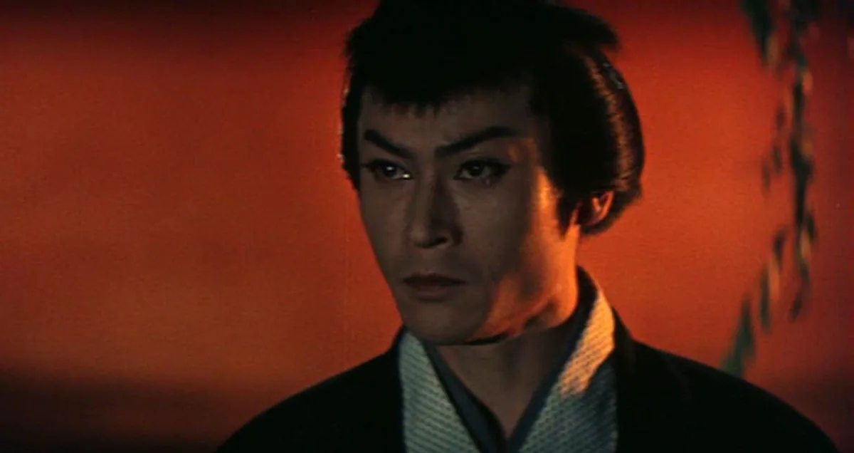 Shigeru Amachi as Iemon against the saturated red backdrop of Nobuo Nakagawa's The Ghost of Yotsuya.