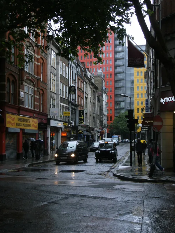 Denmark Street in Soho seen from the Charing Cross Road end, a narrow street of music shops and Victorian buildings near Tottenham Court Road station