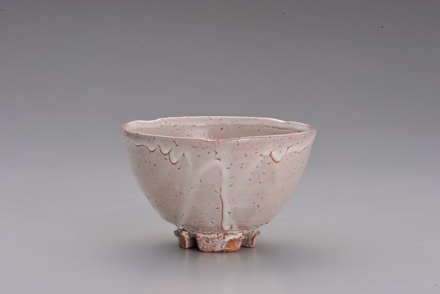 White glazed Hagi ware tea bowl with a notched foot, sold as a Ryokan Collection premium item