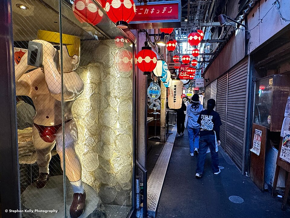Red lanterns hanging over a narrow alley of bars in Harmonica Yokocho, Kichijoji