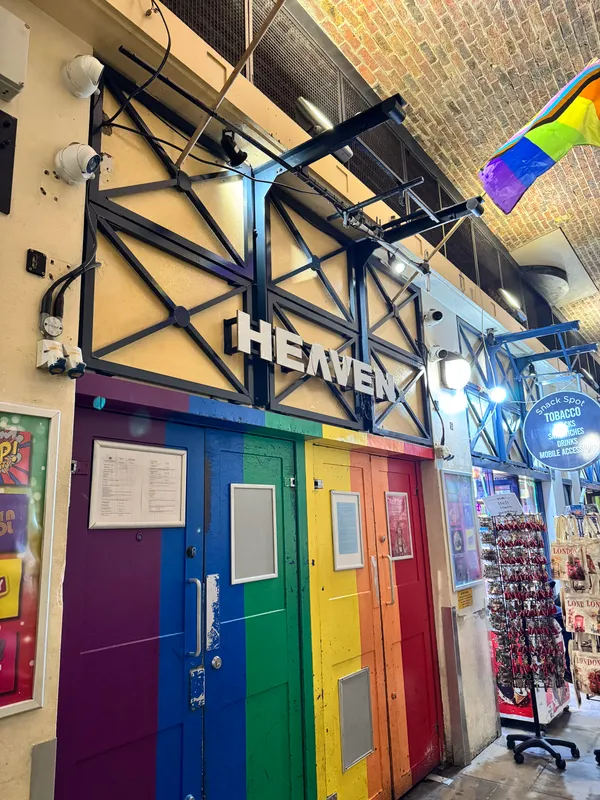The rainbow painted entrance doors of Heaven nightclub under the arches on Villiers Street, beneath Charing Cross station in London