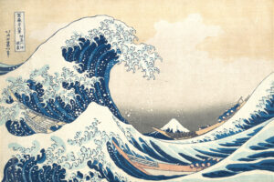 Hokusai's Under the Wave off Kanagawa, the ukiyo-e woodblock print of a towering blue wave curling over three fishing boats with Mount Fuji small on the horizon, the centrepiece of Beneath the Great Wave at the Whitworth, Manchester