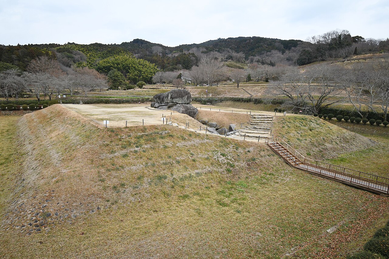 The grassy mound and exposed stone chamber of the Ishibutai Kofun in Asuka, Nara Prefecture