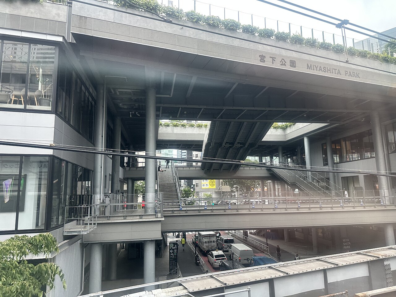 The exterior of Miyashita Park in Shibuya with its name sign on the bridge over the street