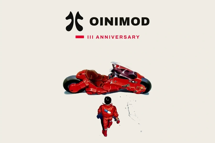 Kaenda, a character from Akira in a red outfit walks towards the iconic futuristic red motorcycle, beneath the OINIMOD III Anniversary logo.