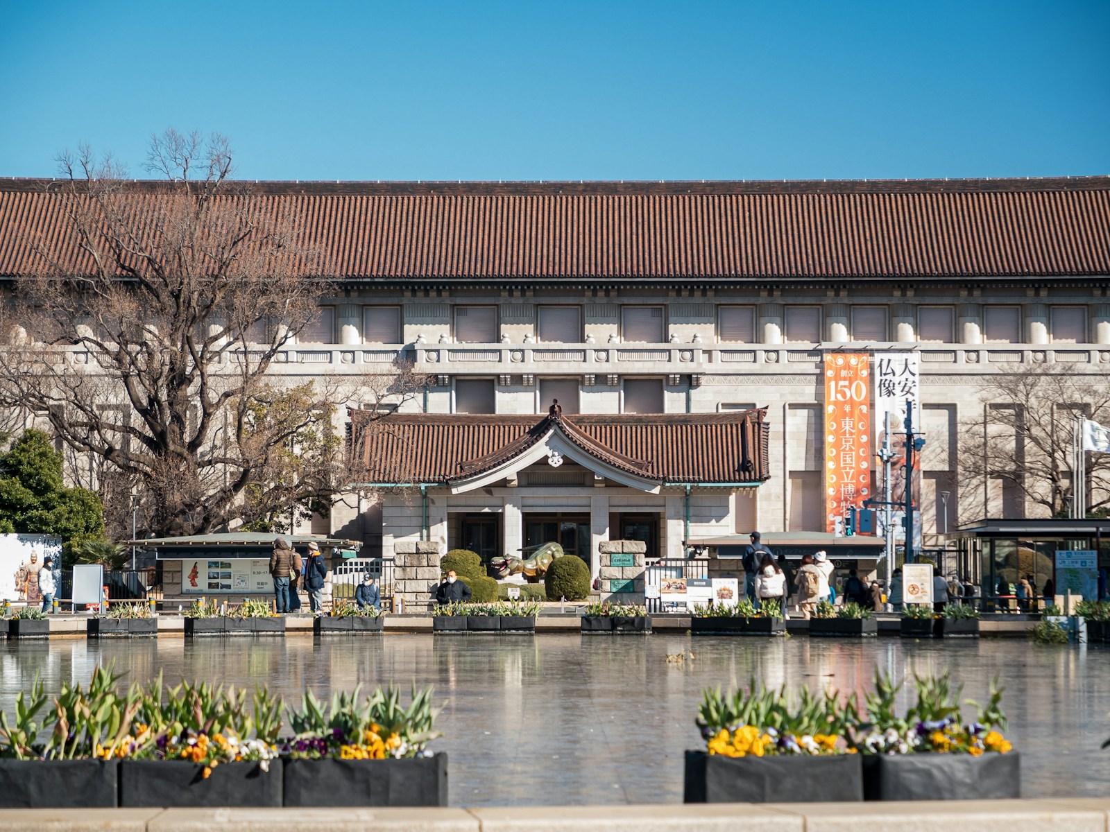 The Honkan main building of the Tokyo National Museum in Ueno Park, seen across its pond