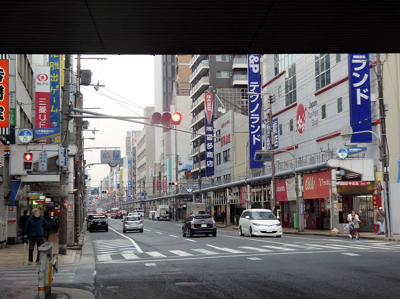 Shops and electronics stores lining the main road through Den Den Town in Nipponbashi, Osaka