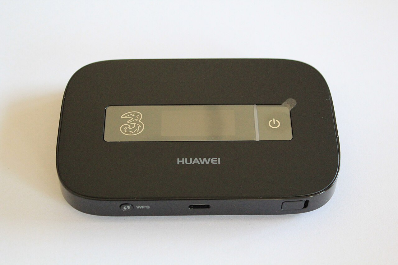 A black Huawei E5756 pocket WiFi router, a battery powered mobile hotspot that lets several phones and laptops share one data connection