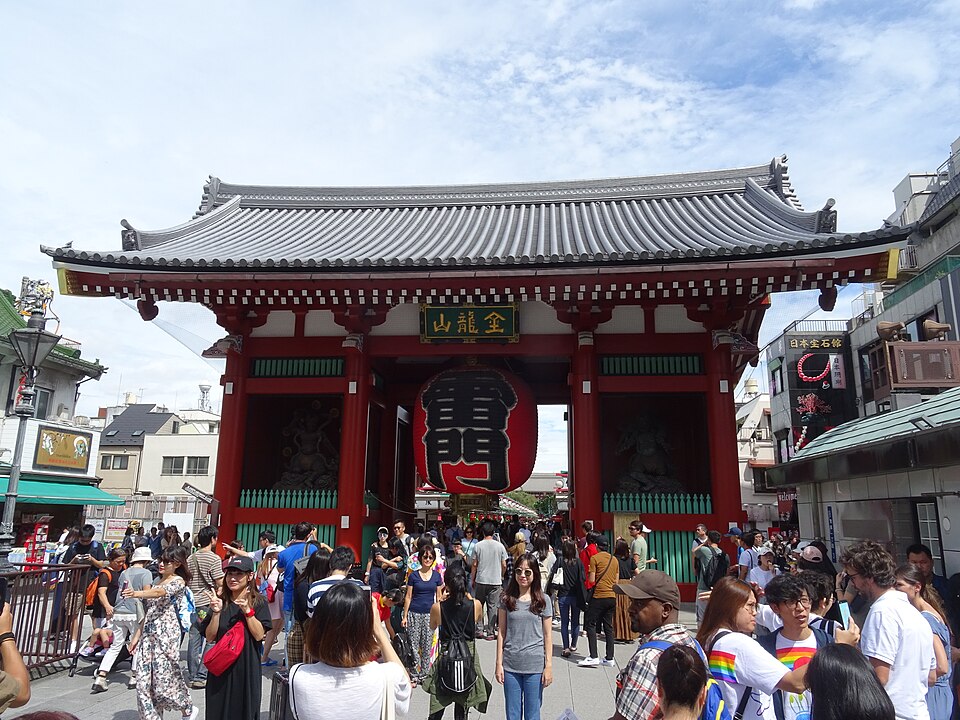 Visitors in front of the Kaminarimon gate and its giant red lantern at Senso-ji in Asakusa