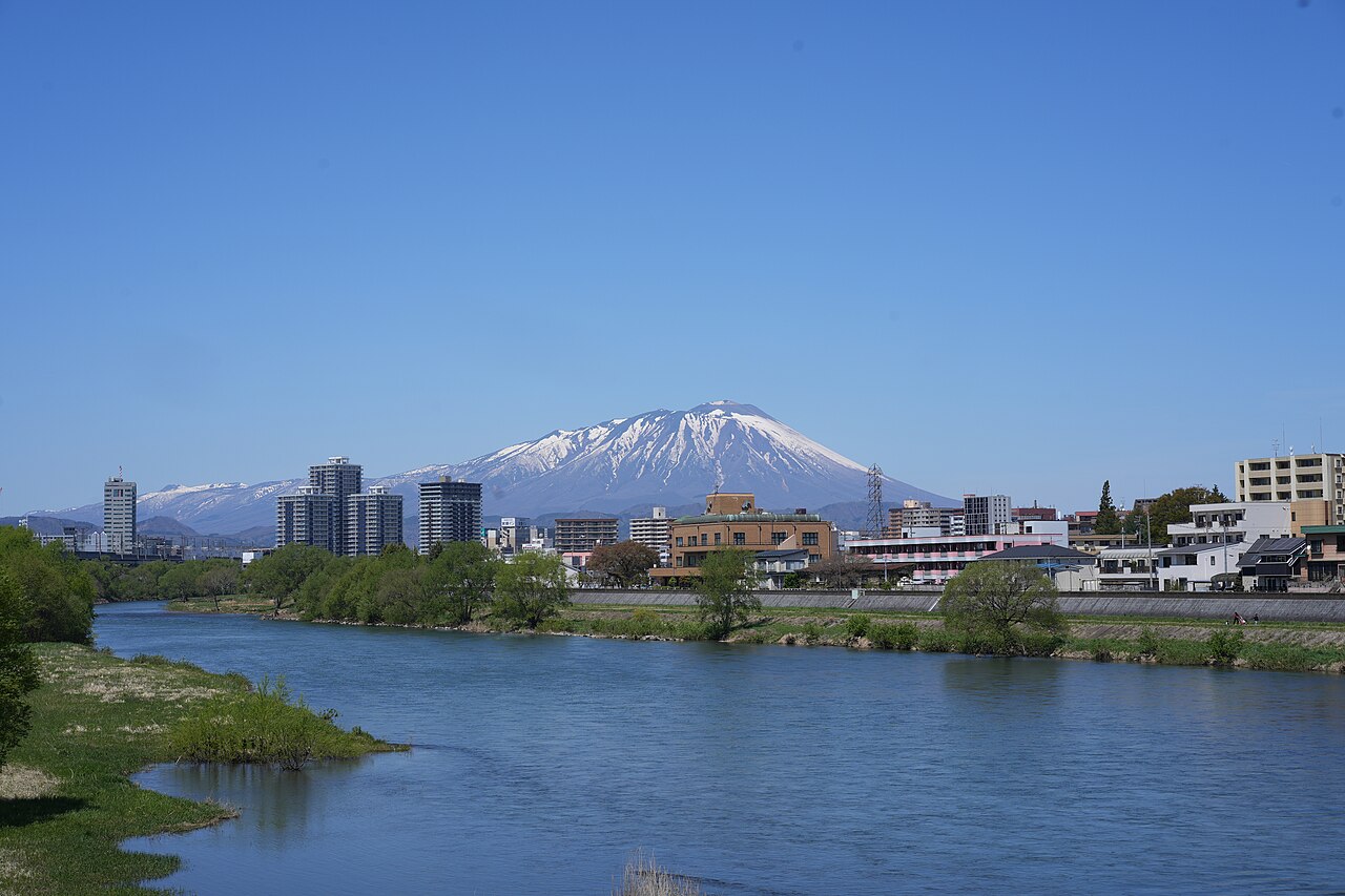 Snow-capped Mount Iwate rising behind Morioka city and the Kitakami River