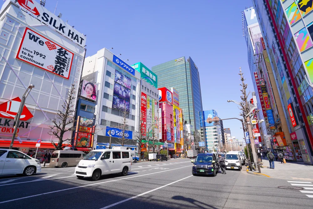 Chuo Dori in Akihabara Electric Town on a sunny day, lined with electronics and anime shop signs