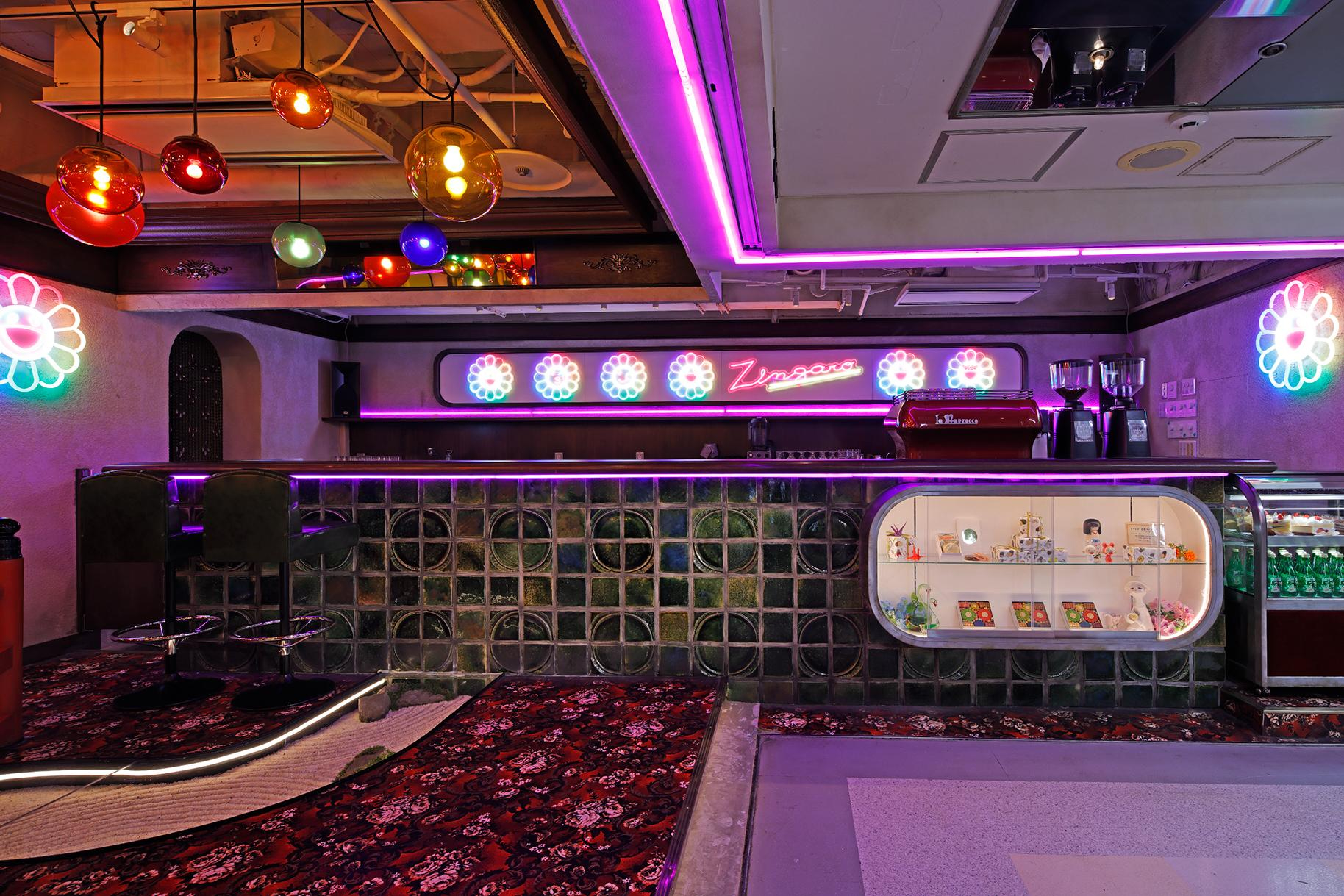 Neon lights, a tiled counter and a patterned carpet inside Coffee Zingaro at Nakano Broadway