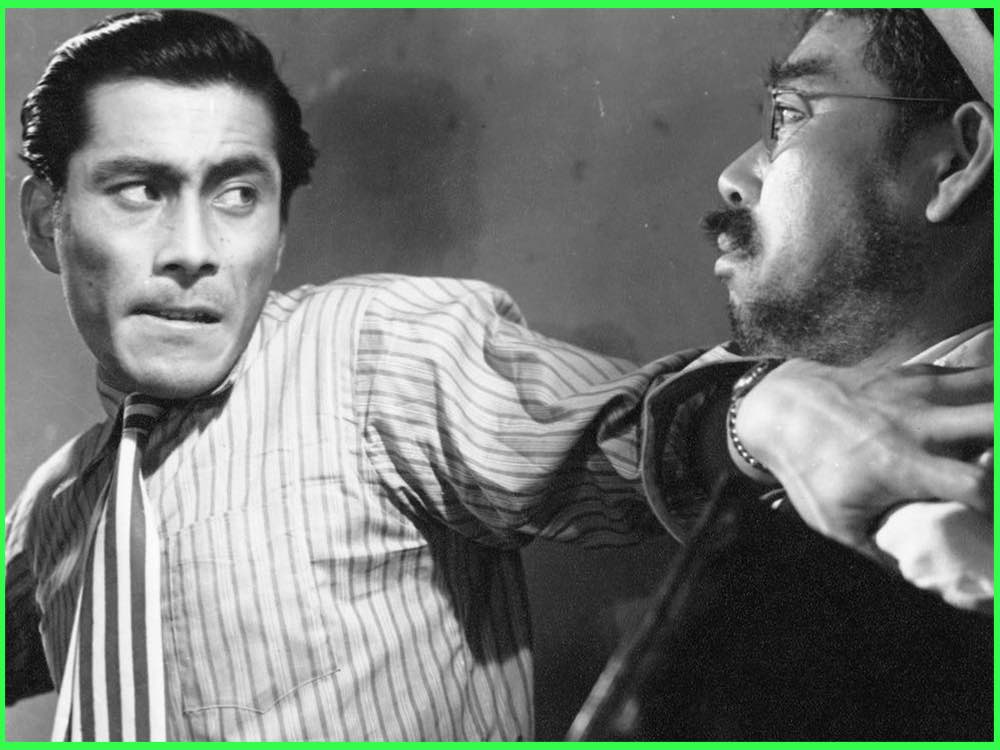 Black and white still from Drunken Angel (1948): Toshiro Mifune in a striped shirt grabs a doctor in glasses by the collar