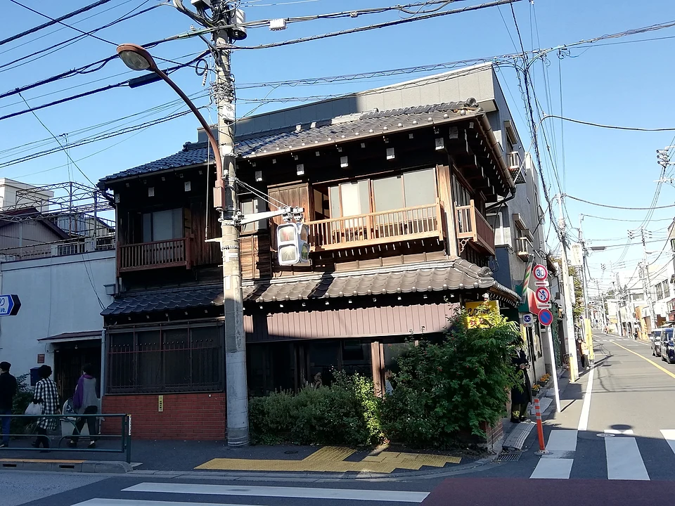 Kayaba Coffee, a two storey traditional wooden building on a street corner in Yanaka