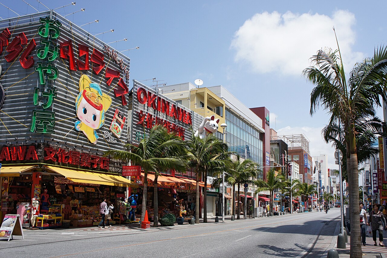 Souvenir shops and palm trees along Kokusai Dori, the main shopping street in Naha, Okinawa