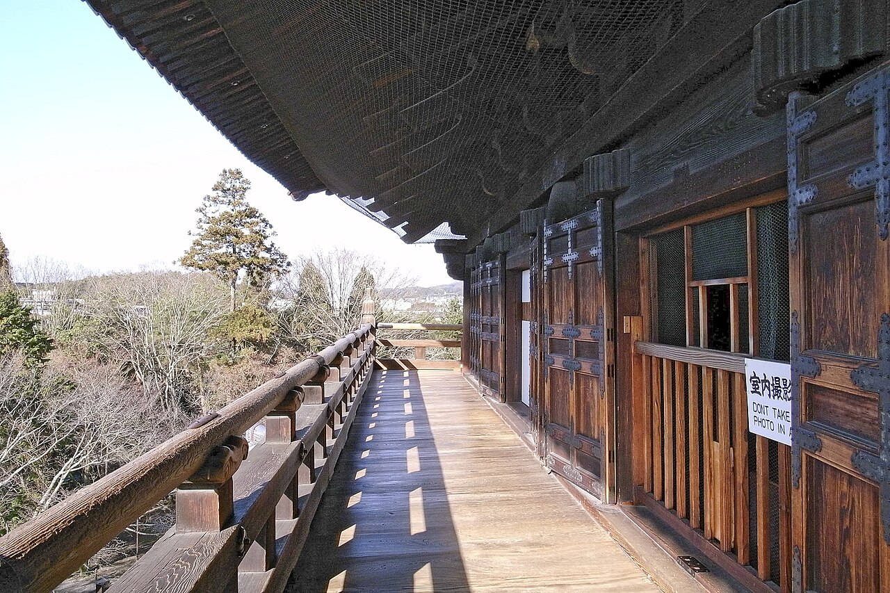 The wooden upper balcony of the Sanmon gate at Nanzen-ji in Kyoto, looking out over the treetops of the temple grounds