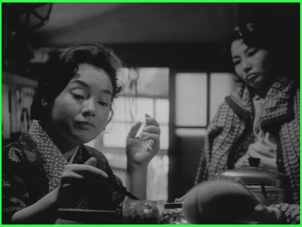 Black and white still from The Insect Woman (1963): two women in kimono sit together in a cramped room, one gesturing as she talks