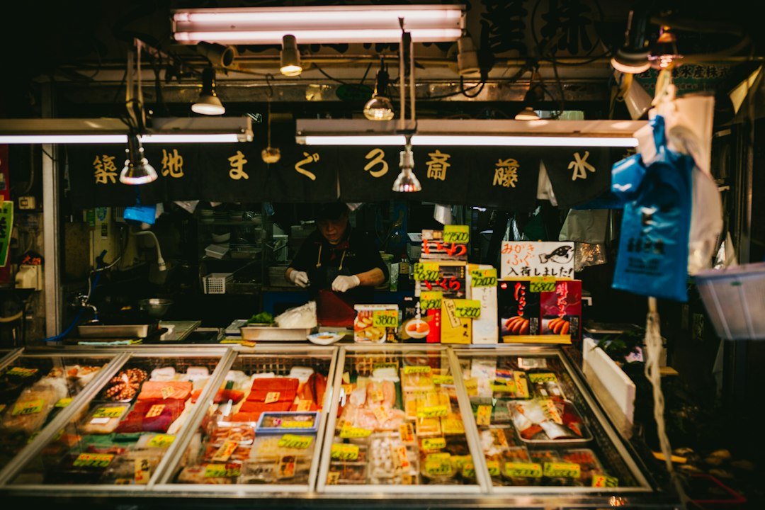 A tuna and seafood stall with chilled display counters in Tsukiji Outer Market
