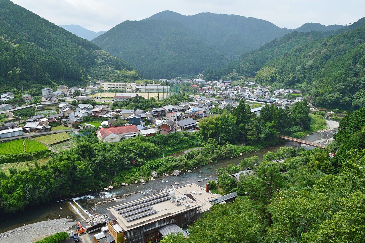 Houses of Umaji village in the Yasuda River valley, surrounded by forested mountains